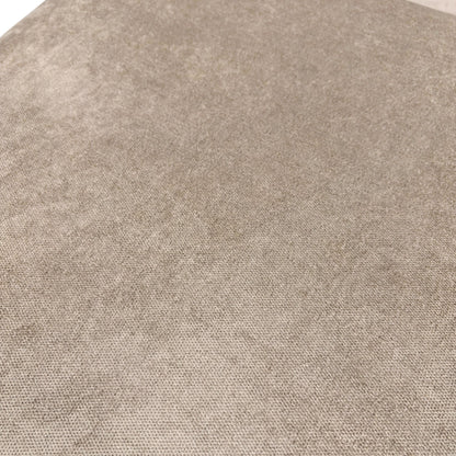 Close-up on the contemporary wooden feet and the bottom edge of the mink fabric sofa.