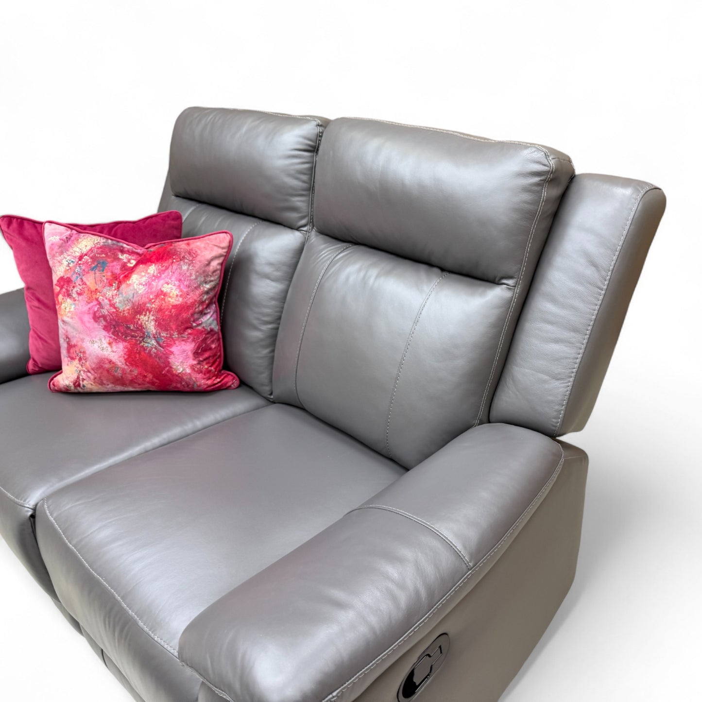 Close-up texture detail of the elephant grey leather upholstery and contrast stitching on the 'Maverick' sofa.