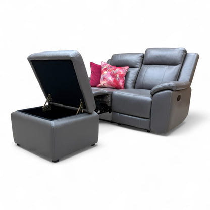 Detailed view of the matching upholstered footstool, with the lid lifted to reveal the interior storage space.