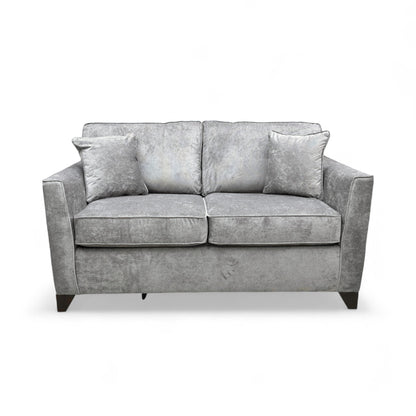Frontal view of the ‘Smith’ Grey Fabric Sofa, emphasizing the size, armrests, and seat cushions.
