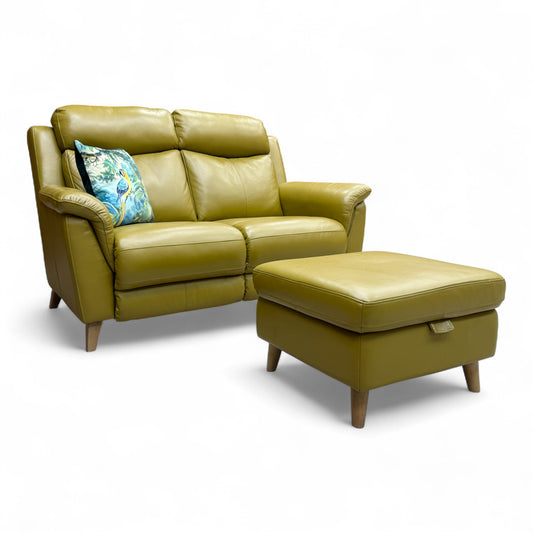 Side profile of the 'Sienna' sofa, illustrating the high backrest and padded arms.