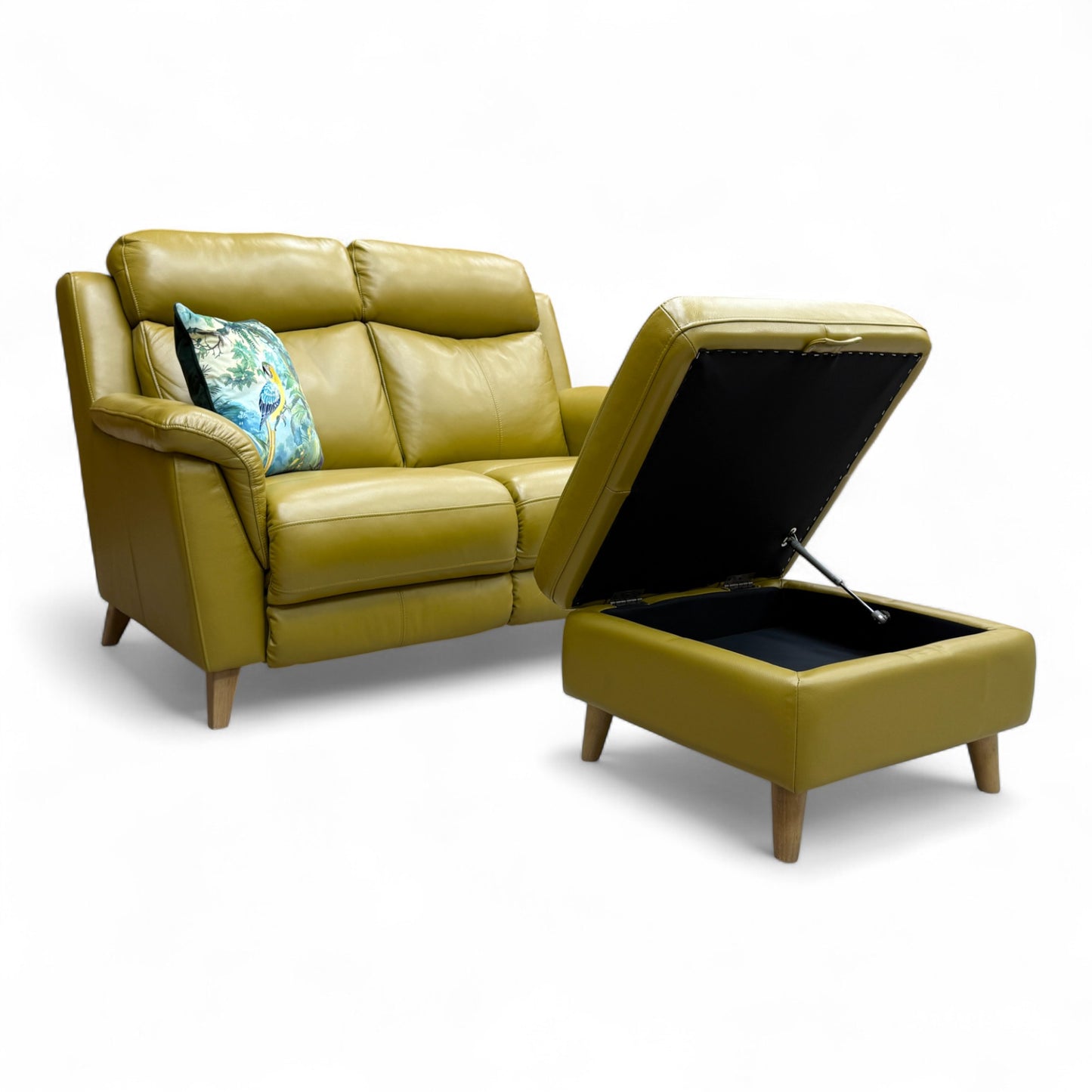 Image showing the small storage footstool next to the 'Sienna' sofa, illustrating how the lid lifts to reveal internal storage space.