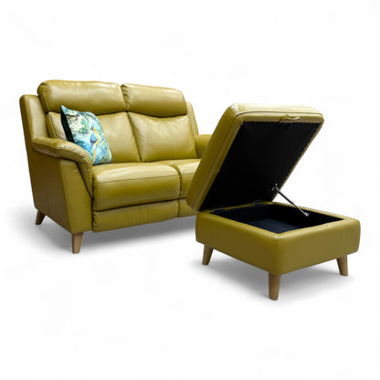 Image showing the small storage footstool next to the 'Sienna' sofa, illustrating how the lid lifts to reveal internal storage space.