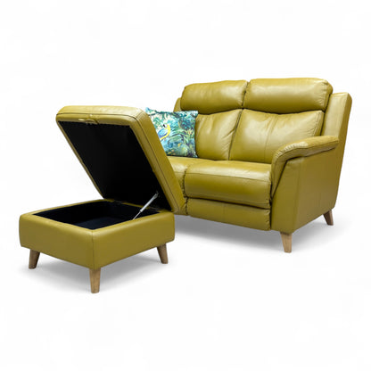 View showing the footstool closed, detailing the upholstered top and compact size.