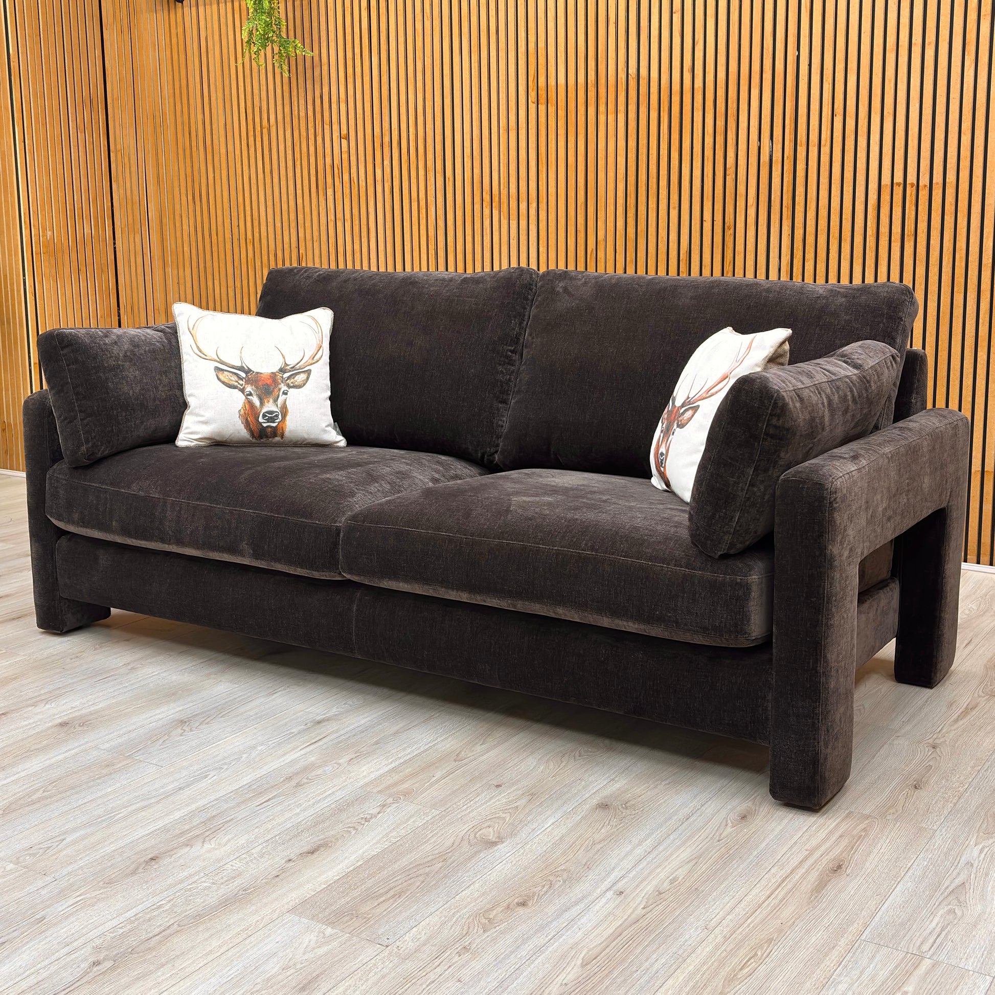 Detailed view focusing on the deep seat cushions and the plush back cushions of the dark chocolate chenille sofa.