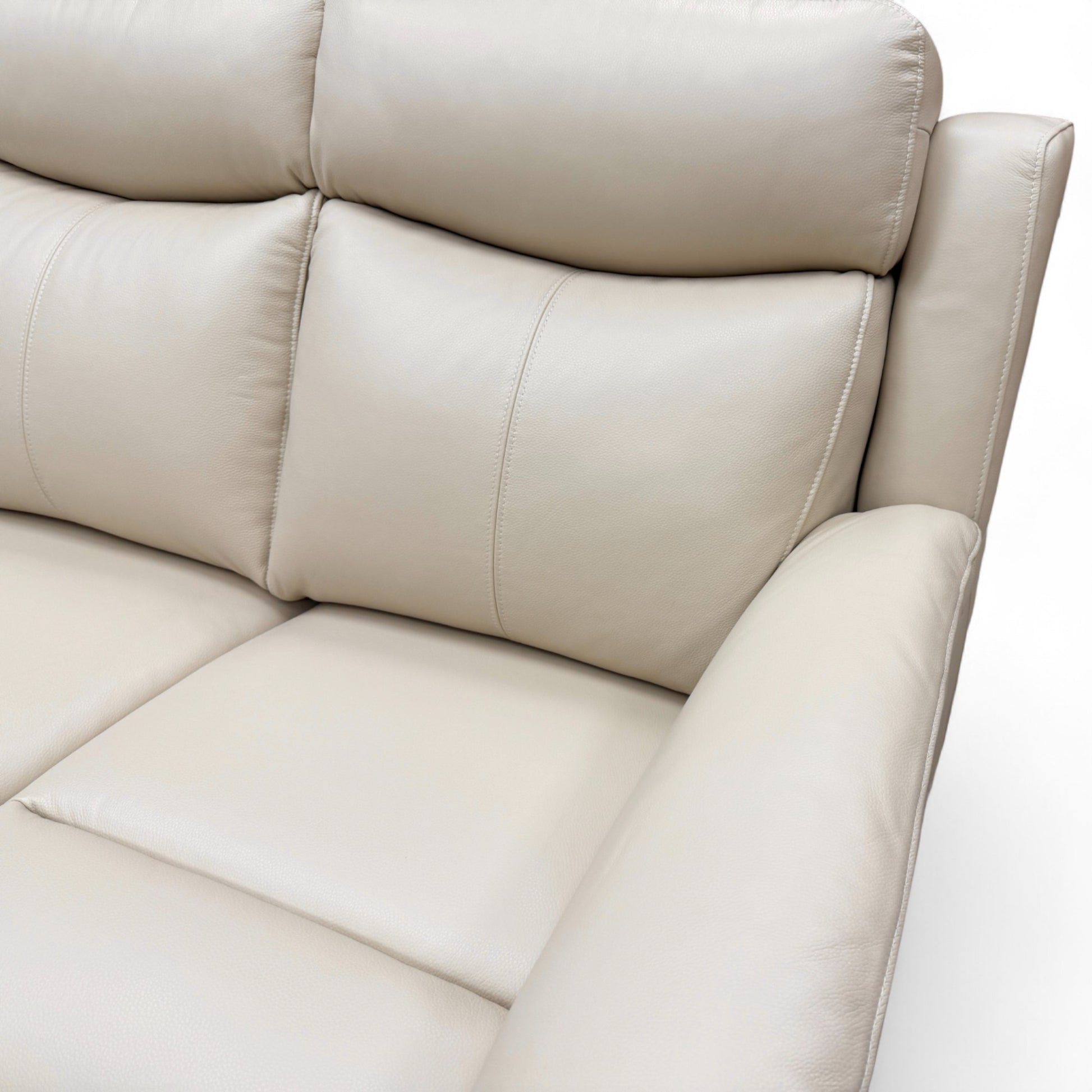 Close-up detail of the khaki green leather upholstery on the armrest and side of the 'Ava' chair, showing the texture and stitching.