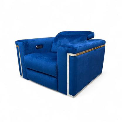 Side profile view of the 'Cora' Royal Blue Velvet Power Recliner Armchair, with the footrest fully extended in the reclined position.