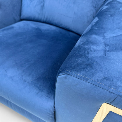 Close-up texture detail of the plush royal blue velvet fabric on the 'Cora' Power Recliner.