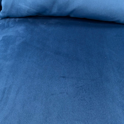 Close-up of the sensual velvet fabric texture, showing the rich dark blue colour and sheen.