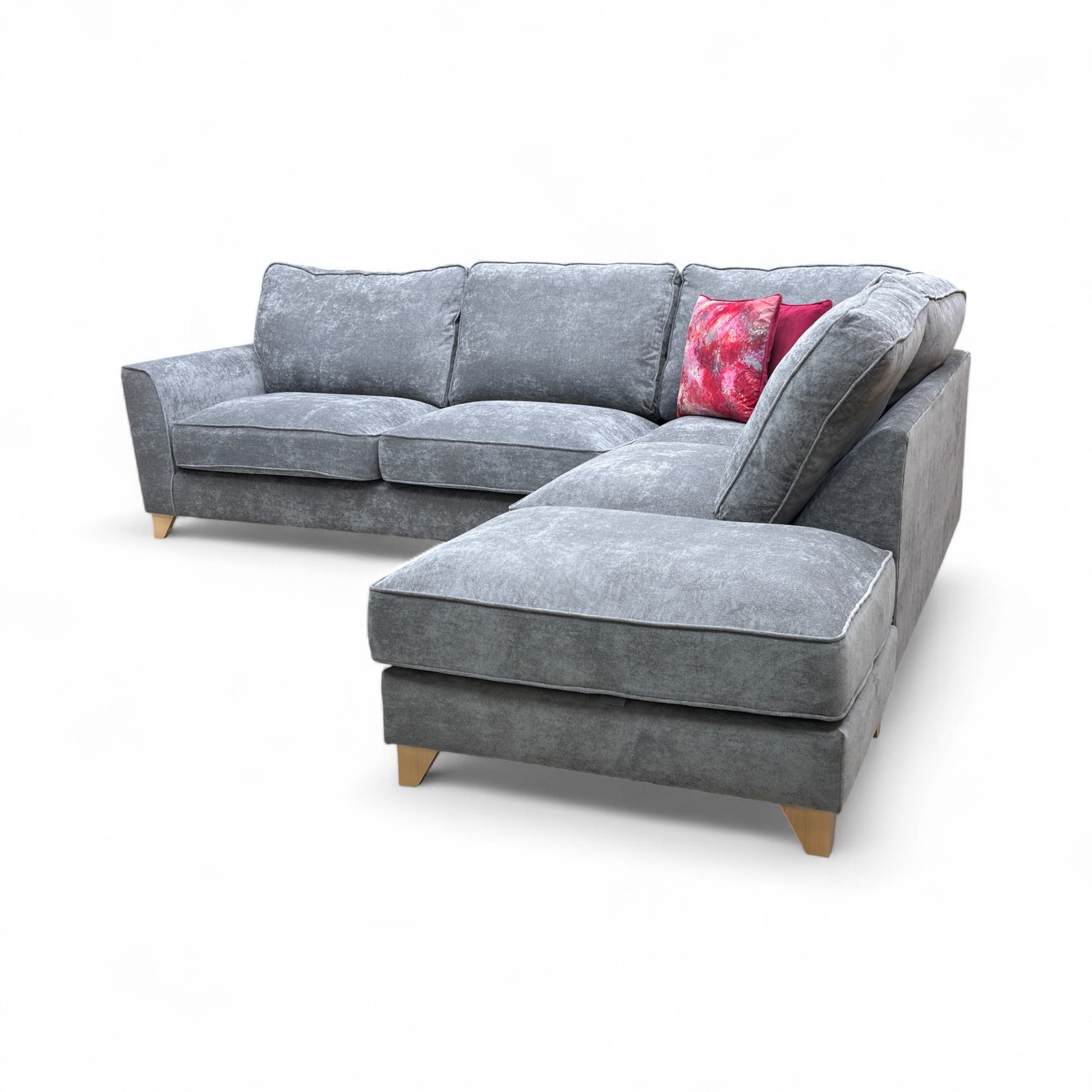 A shot focusing on the sofa's base, legs, and the intersection point of the corner or chaise section.
