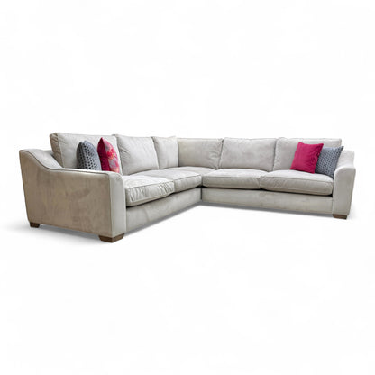 A view of the back and side of the 'Isobel' corner sofa, showcasing its sophisticated silhouette and finished backing.