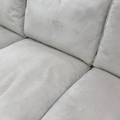 Close-up texture detail of the high-quality, plush stone velvet fabric on the 'Isobel' corner sofa.
