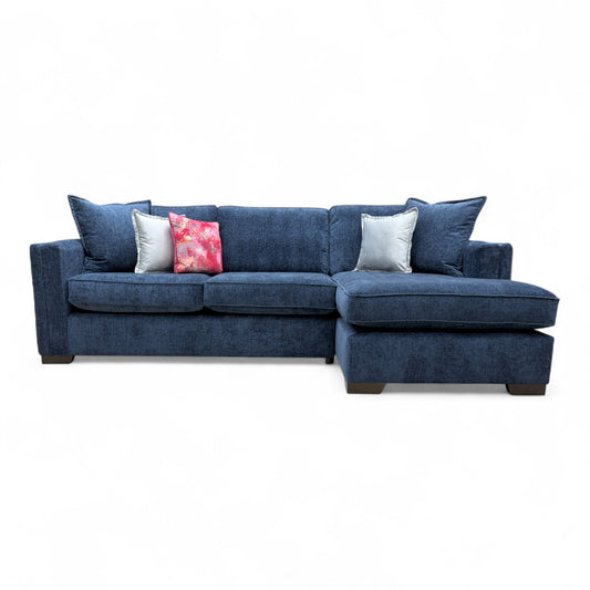 Angled view of the 'Chelsea' RHF corner chaise, highlighting the deep seating, shelter arms, and contemporary style.