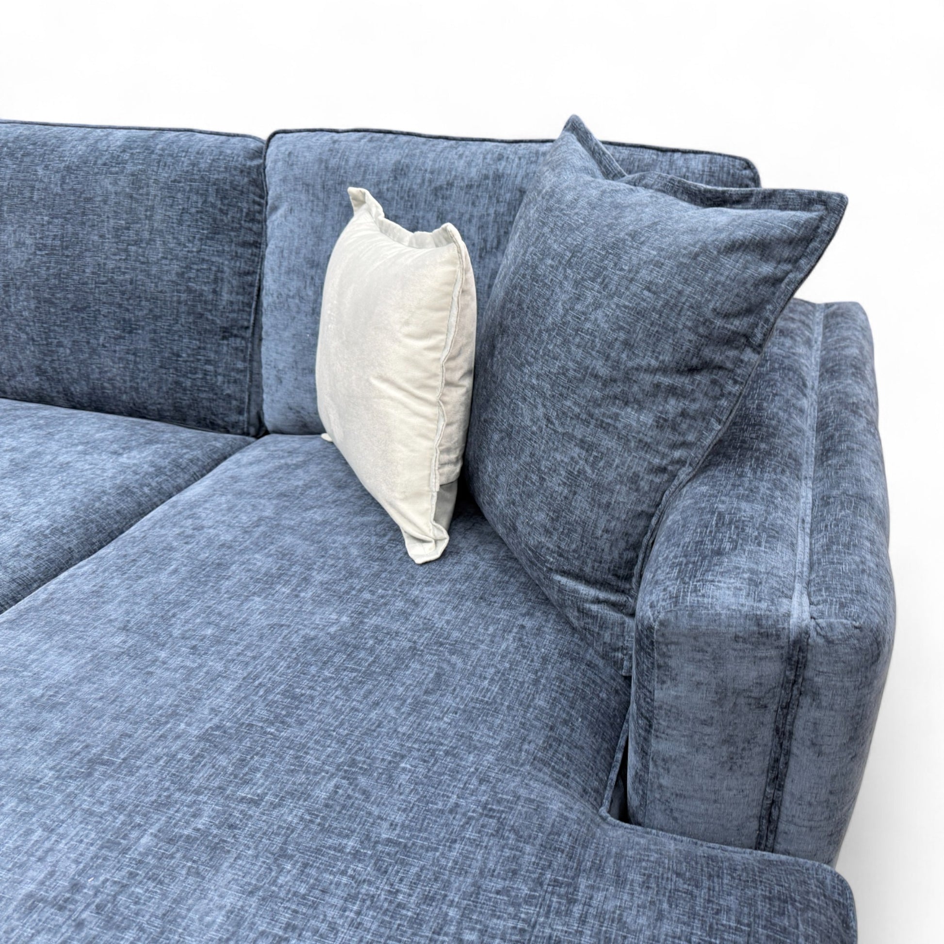 Close-up texture detail of the navy blue Paso chenille fabric, showing the soft weave and deep color.