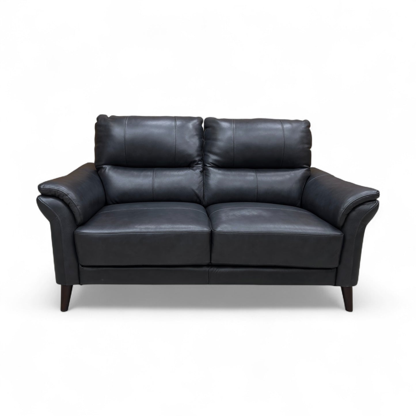 Full front view of the ‘Winner’ Montana 2 Seater Sofa in rich navy leather, showcasing the rolled arms and two seat cushions.