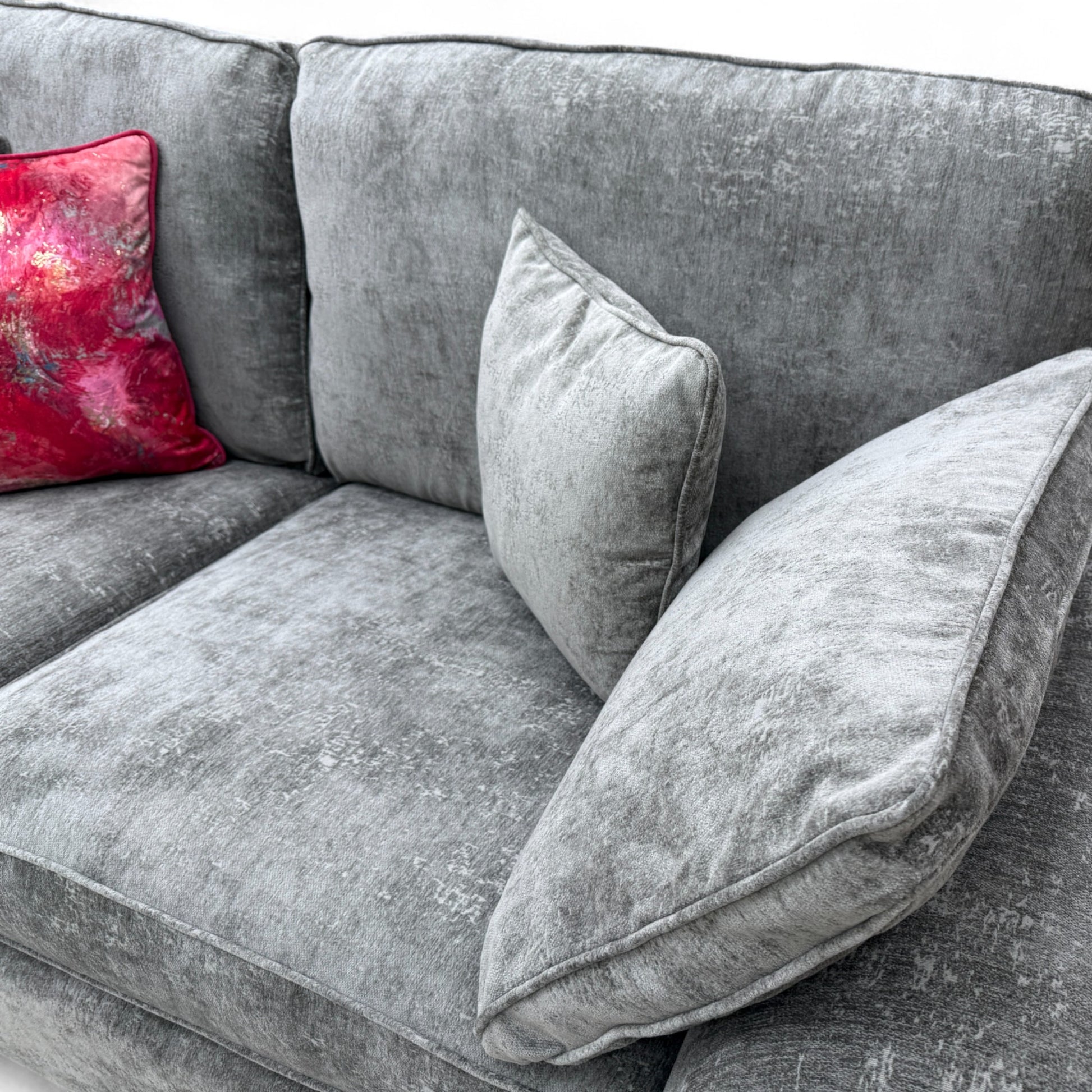 Close-up texture detail of the Meridian Charcoal Grey Chenille fabric on the sofa, emphasizing the weave and dark grey colour.