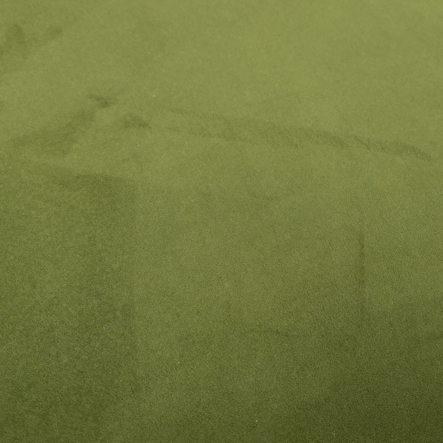 A close-up of the stitching and detailing around the edges of the footstool lid.