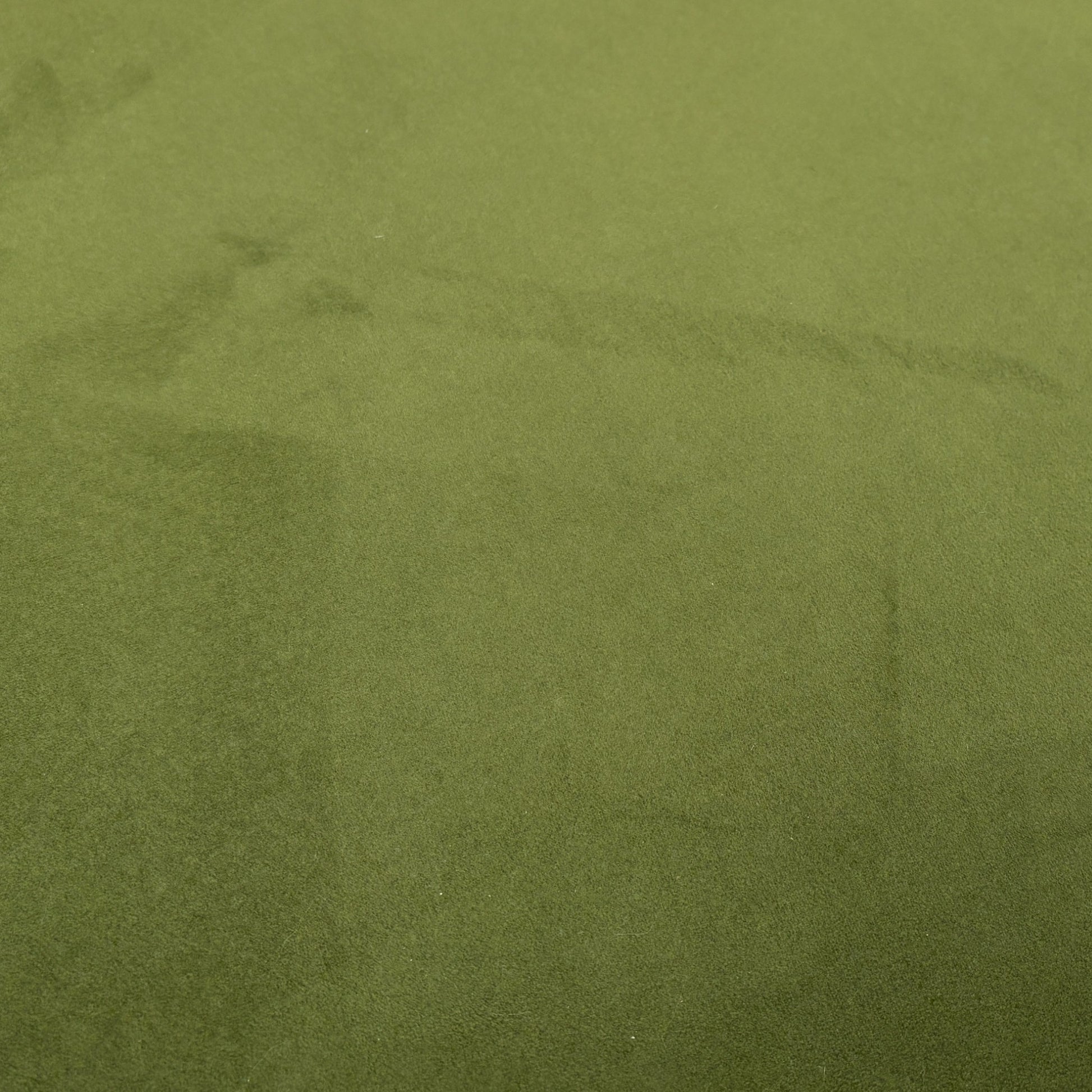 A close-up of the stitching and detailing around the edges of the footstool lid.