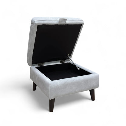 The footstool shown in an open position with the lid lifted, revealing the internal storage compartment.