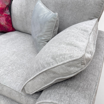 Close-up texture detail of the Paso Light Grey Chenille fabric on the sofa, emphasizing the weave and solid grey colour.