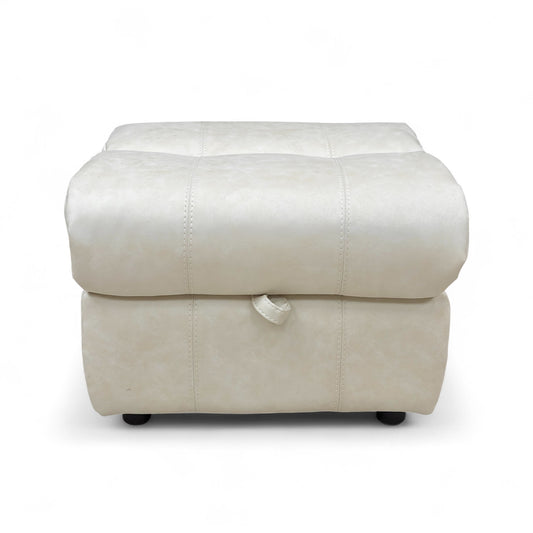 Angled view of the Moreno Dapple Grey Leather Storage Footstool in a closed position, showing its cube shape and stitching detail.