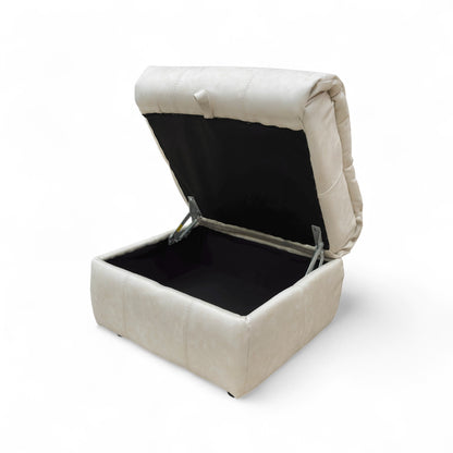 The footstool with the lid removed and placed beside it, clearly showing the depth and capacity of the storage space.