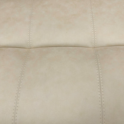 Detail shot focusing on the lower part of the footstool, showing the wooden or subtle feet/base.