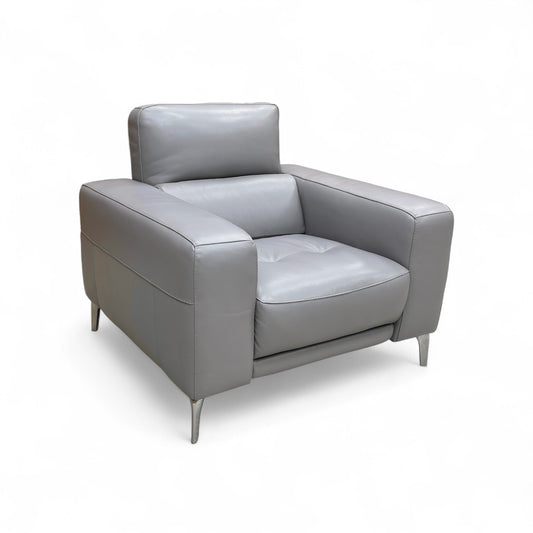 A different full view, possibly showing the armchair in a neutral or dark room setting.