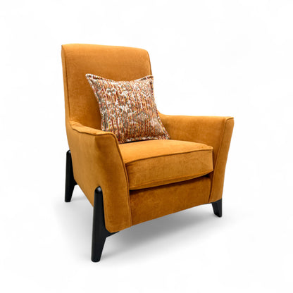 Full, straight-on view of the 'Collins' modern accent chair, upholstered in a striking almond orange towel velvet fabric with a sloped arm design.