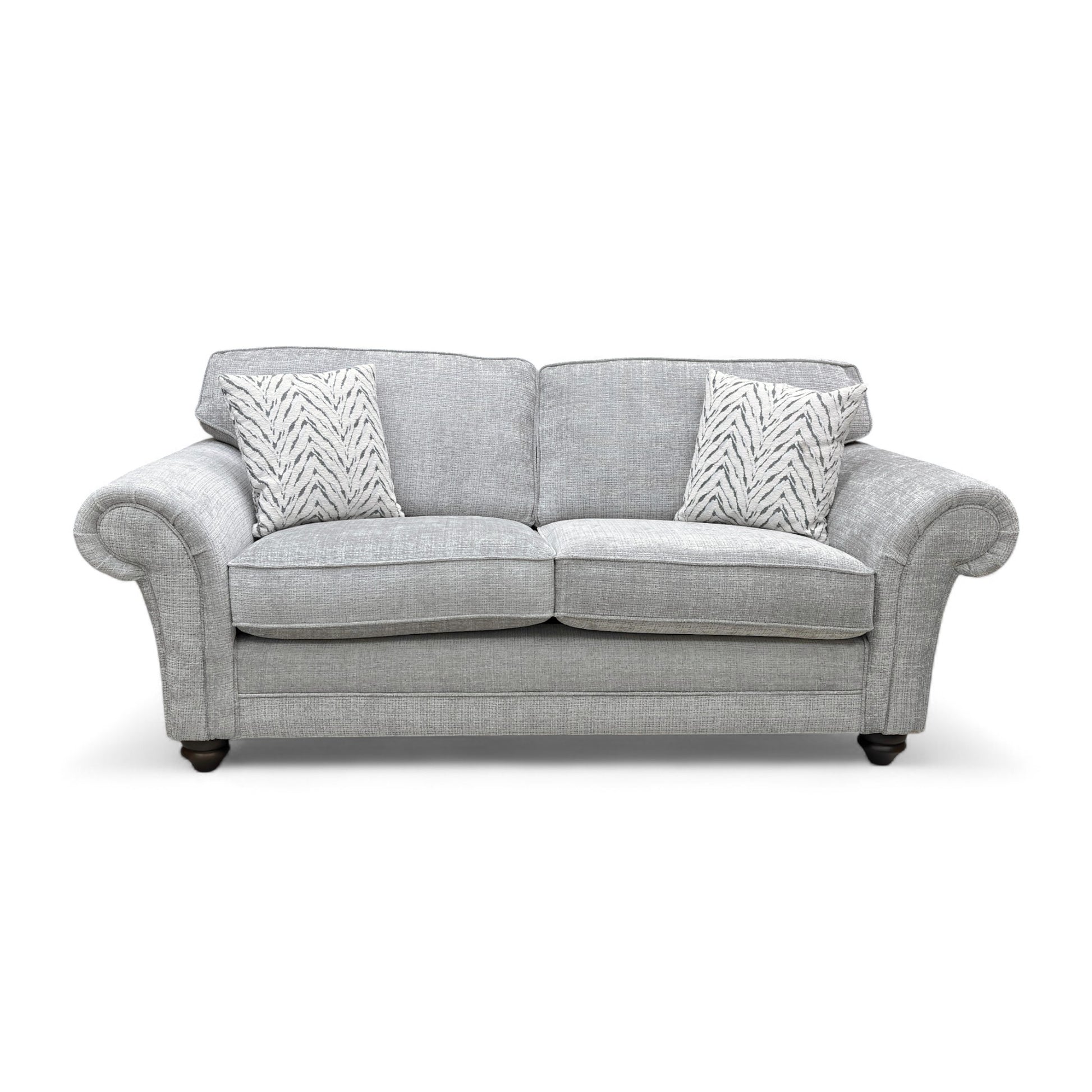 Full front view of the ‘Clara’ 3 Seater Sofa in silver woven fabric, showcasing the cushion back and scroll arms.