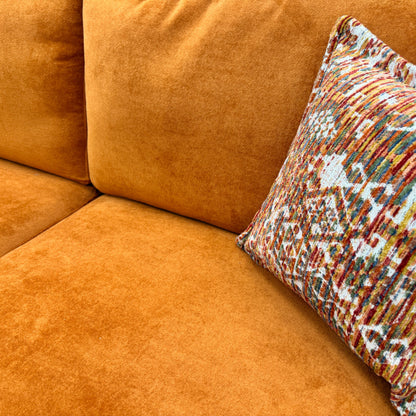 Close-up of the 'towel' texture of the Almond Orange Velvet fabric, showing the soft, distinct pile and color vibrancy.