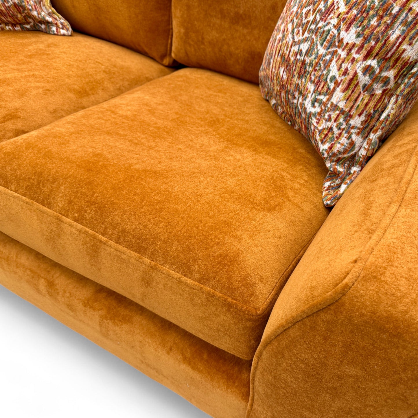 Close-up detail of the Almond Orange 'Towel Velvet' fabric upholstery on the 'Collins' 2 Seater Sofa, showing the plush, textured pile.