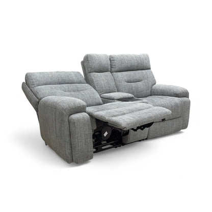 A view of the sofa with the power recliners fully extended and the power headrests adjusted, demonstrating the relaxed position.