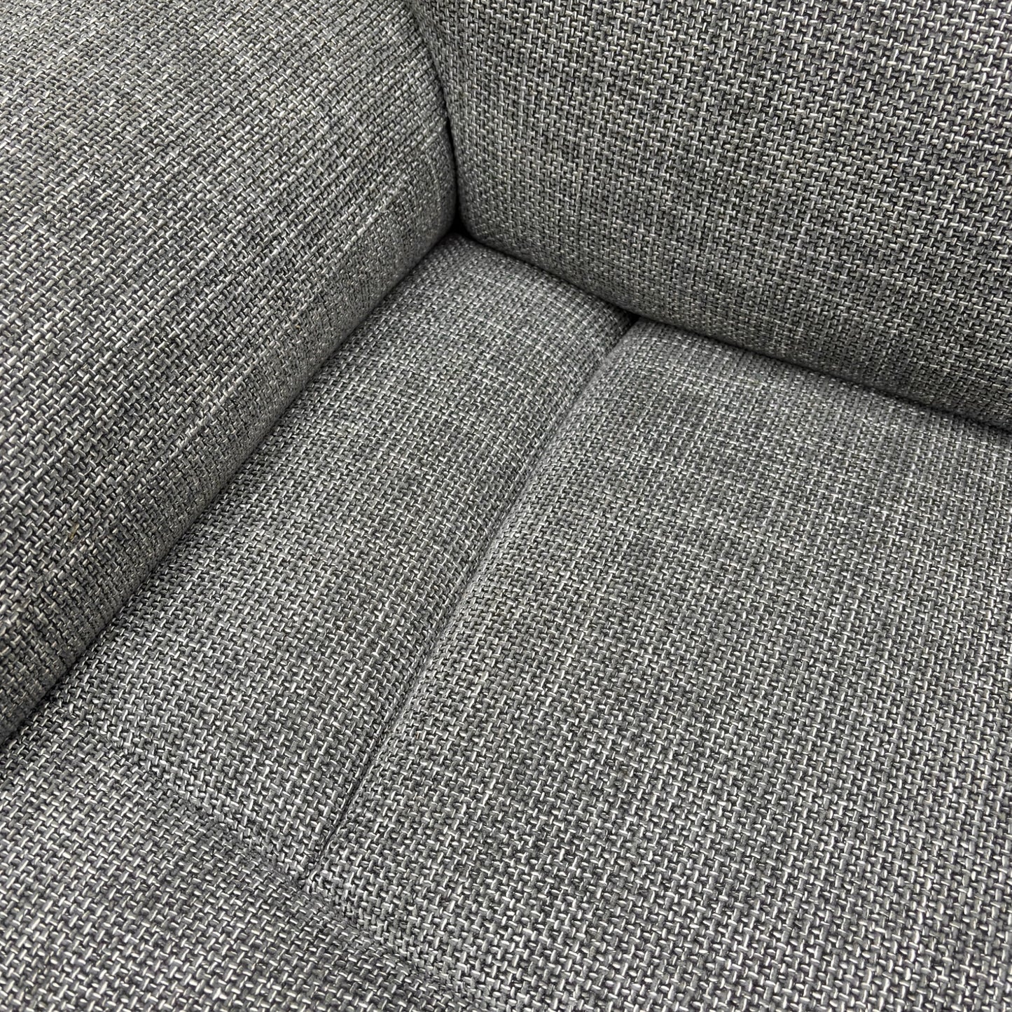 A close-up on the side panel or armrest, showing the control buttons for the power recliner, power headrest, and massage function.