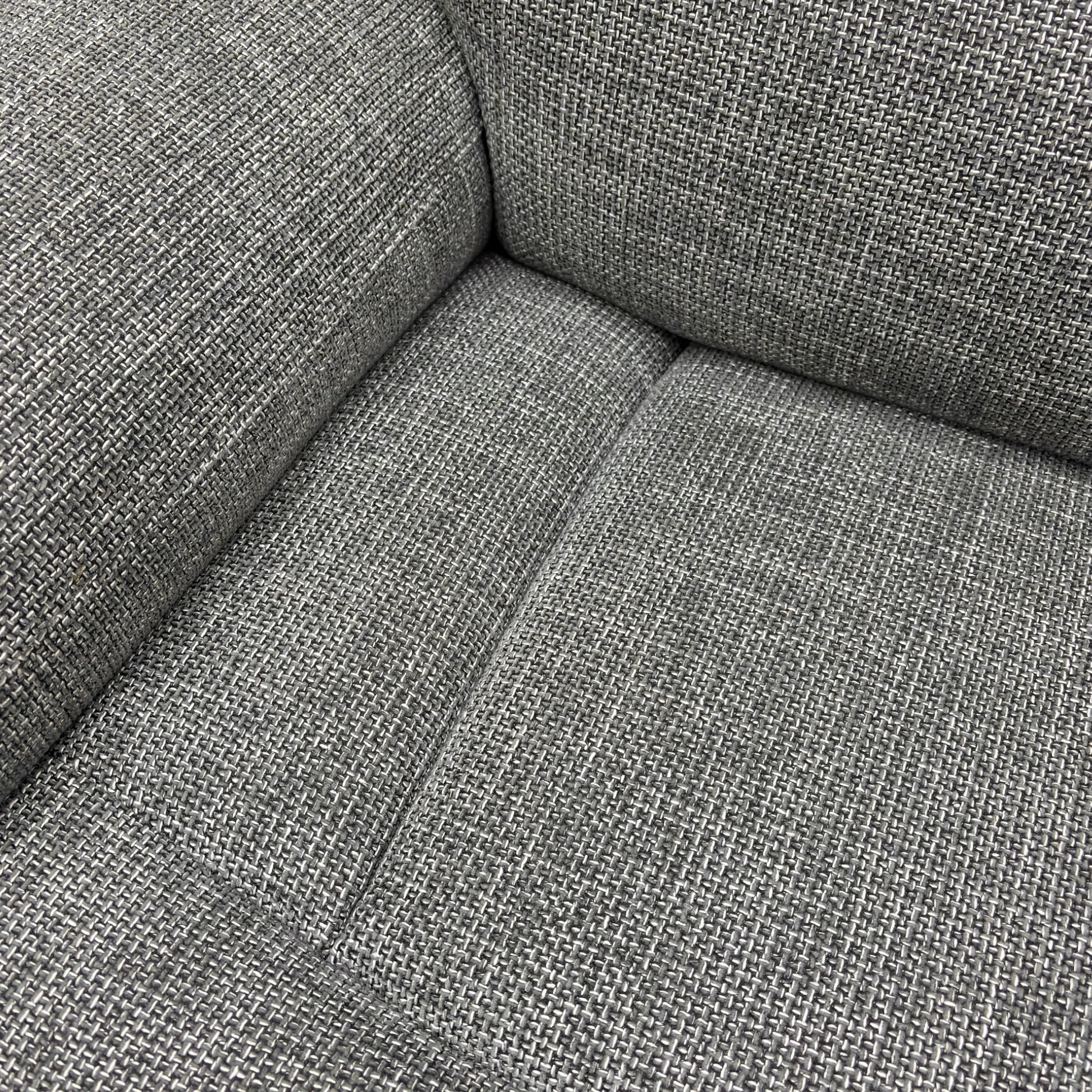 A close-up on the side panel or armrest, showing the control buttons for the power recliner, power headrest, and massage function.