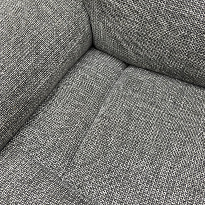 A close-up on the side panel or armrest, showing the control buttons for the power recliner, power headrest, and massage function.