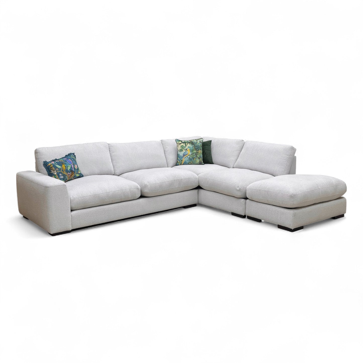 A view focusing on the seat cushions and the stitching detail, or an angle of the open chaise end.