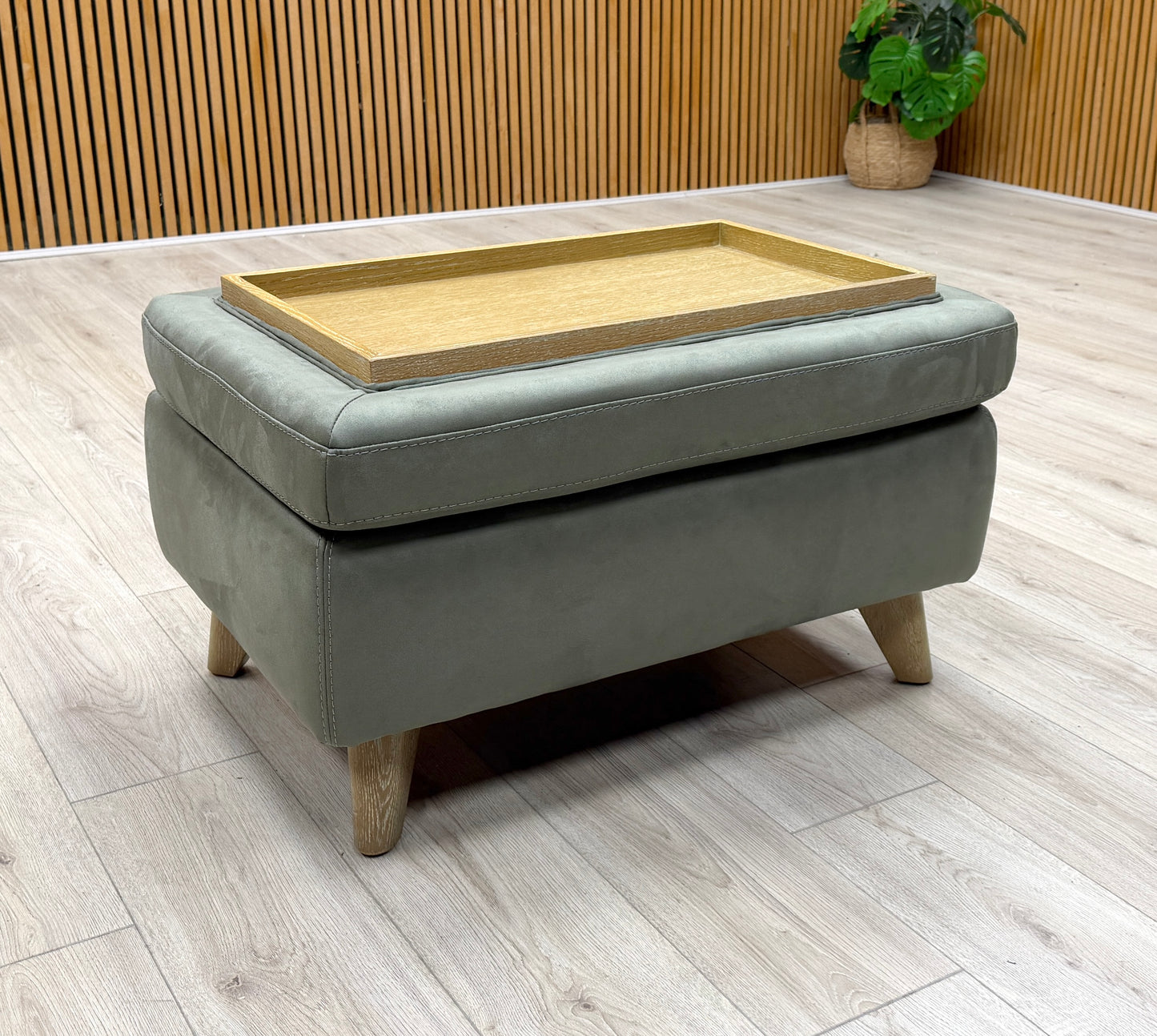 Detailed shot of the Malmo Olive footstool, showcasing its clean rectangular silhouette and tapered wooden feet on a white background.