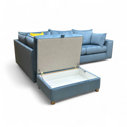 A view demonstrating the push-up mechanism and internal storage space of the rectangular footstool.