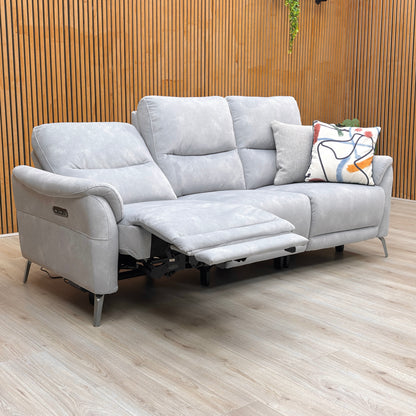 Lifestyle shot of the ‘Dexter’ smoke velvet sofa highlighting the sleek velvet finish and center console.