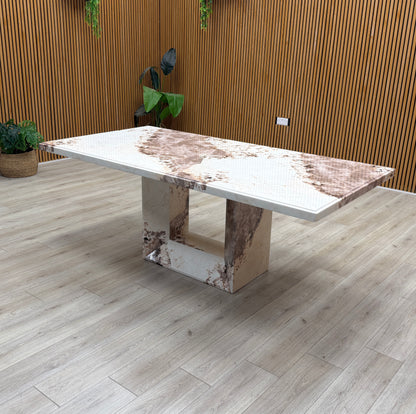 Detailed view of the sturdy table base and the thick marble slab edge, emphasizing the table's durable and substantial build.