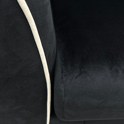 A close-up shot focusing on the shape of the Half Moon Footstool and its use as a continuous extension of the sofa.