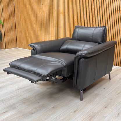 Lifestyle shot of the ‘Jude’ Oslo black leather power recliner chair, highlighting its sleek profile and premium leather finish.