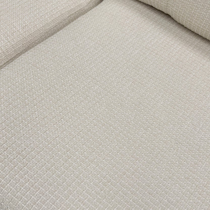 Close-up of the button-back cushions and the texture of the Ivory fabric.