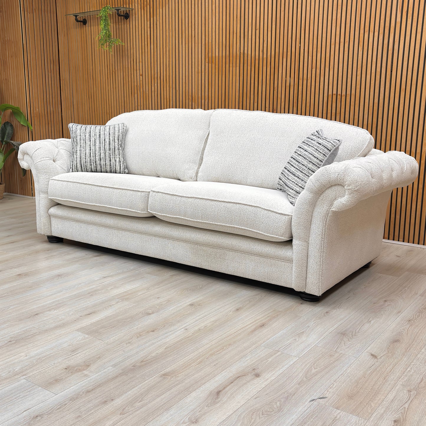 Lifestyle shot of the ‘Vincent’ beige sofa, highlighting the spacious seating and structured formal back.