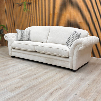 Lifestyle shot of the ‘Vincent’ beige sofa, highlighting the spacious seating and structured formal back.