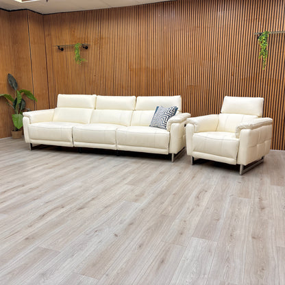 Lifestyle view of the Moet 4-seater sofa, showcasing the pristine white leather upholstery, deep bucket seating, and the sophisticated contemporary silhouette.