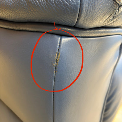 Close-up of a damaged area on the sofa (first damage photo).