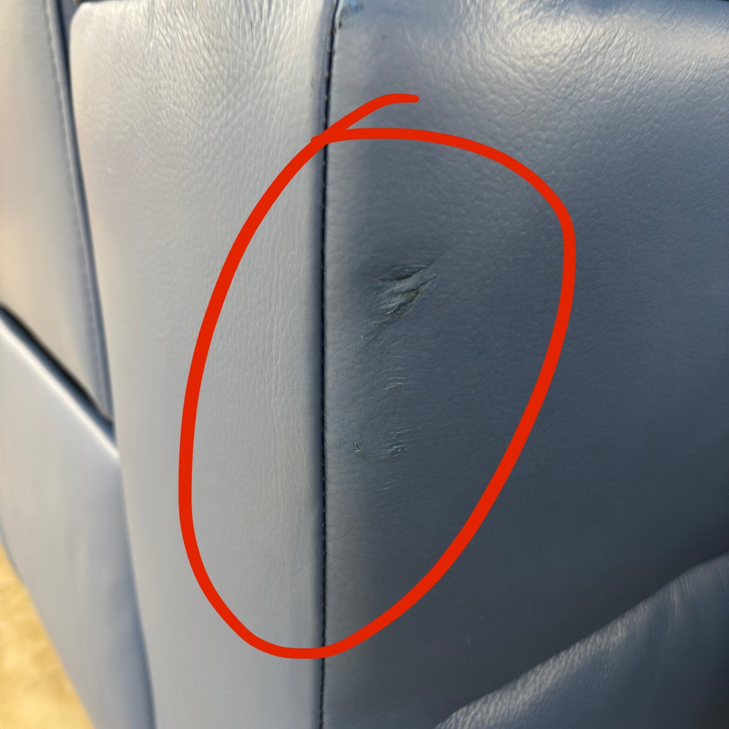 Close-up of another damaged area on the sofa (second damage photo).
