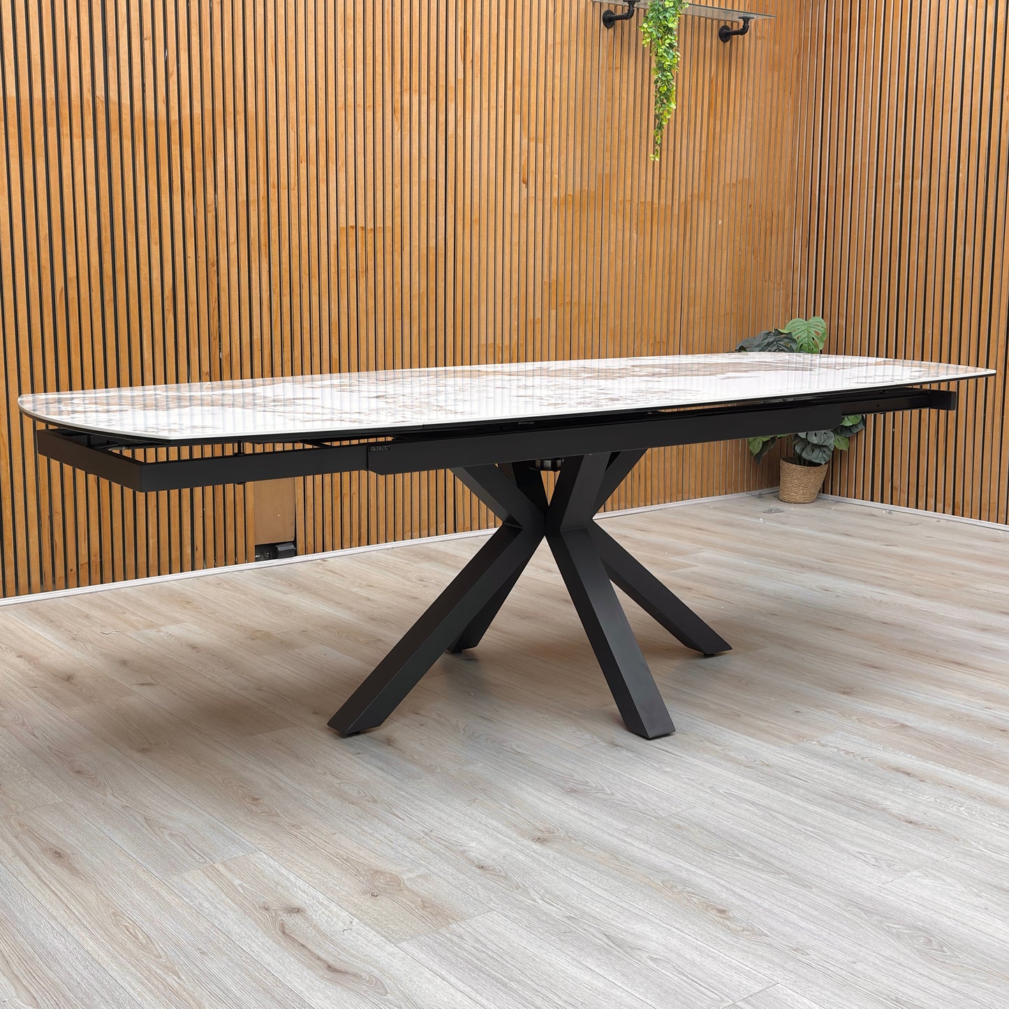 Lifestyle shot of the table legs and steel frame with a durable lacquered finish.